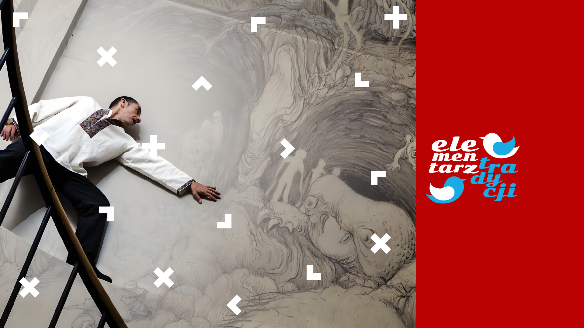 Artysta stoi przy ścianie, którą pomalował. Napis: Elementarz tradycji.